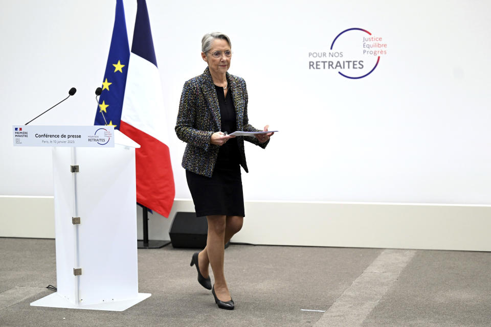 French Prime Minister Elisabeth Borne leaves after delivering her speech during a press conference in Paris, Tuesday, Jan. 10, 2023. Borne is unveiling a highly sensitive pension overhaul aimed at pushing up the retirement age. It has already prompted vigorous criticism and calls for protests from leftist opponents and worker unions. (Bertrand Guay, Pool via AP)