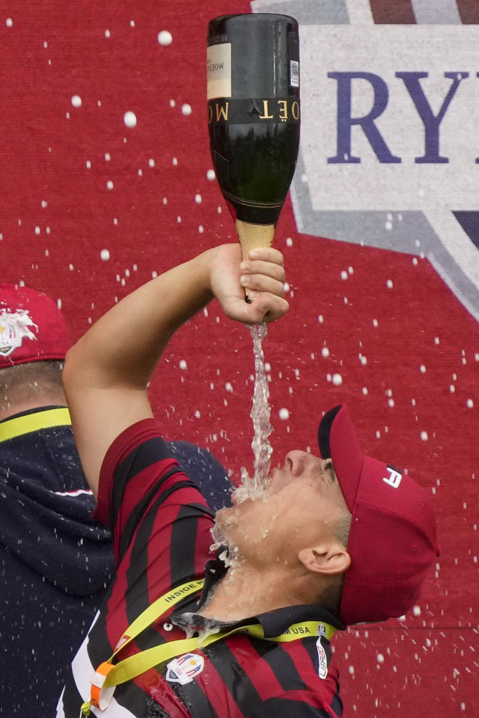 Team USA member celebrates at the closing ceremony after the Ryder Cup matches at the Whistling Straits Golf Course Sunday, Sept. 26, 2021, in Sheboygan, Wis. (AP Photo/Charlie Neibergall)