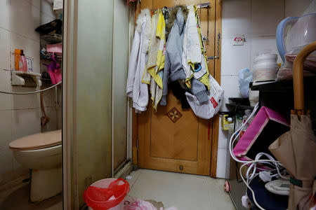 The kitchen (R) and toilet of a 100-square-foot (9-square-metre) sub-divided unit, with a monthly rent of HK4,700 ($606), is seen in Hong Kong, China January 6, 2017. REUTERS/Bobby Yip