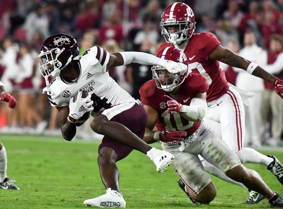 Oct 22, 2022; Tuscaloosa, Alabama, USA;  Alabama linebacker Henry To'o To'o (10) makes a tackle on Mississippi State wide receiver Caleb Ducking (4) at Bryant-Denny Stadium. Alabama defeated Mississippi State 30-6. Mandatory Credit: Gary Cosby Jr.-USA TODAY Sports