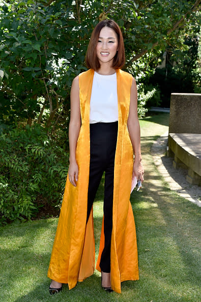 <p>Nicole Warne, better known by her handle @garypeppergirl, kept it simple with a white top and black pants but with a canary yellow silk trench vest, she brought her outfit to new heights.</p>