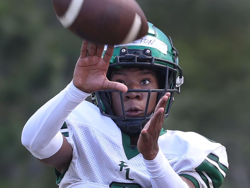 Father  Lopez High's Jonathan Felton #6 keeps his eye on the ball as he grabs a pass, Wednesday May 10, 2023 during spring practice.