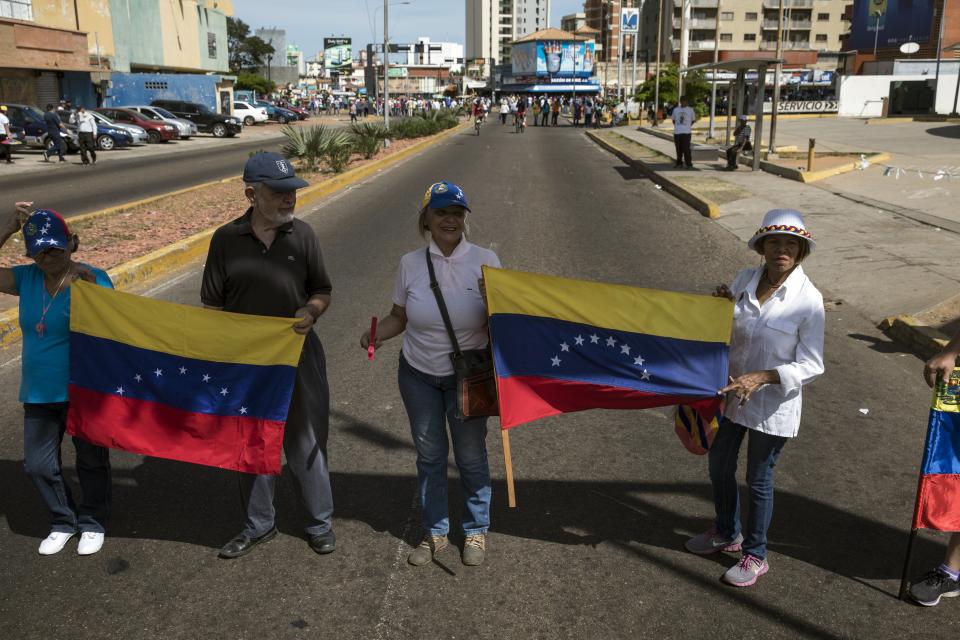 In this Nov. 16, 2019 photo, anti-government protestors block a road during a nationwide demonstration in Maracaibo, Venezuela. Opposition leader Juan Guaido, who seeks to oust President Nicolas Maduro, has urged Venezuelans to take to the streets, trying to reignite a movement started early this year. However, few in Maracaibo have responded, despite it being a city hard hit by crisis. (AP Photo/Rodrigo Abd)