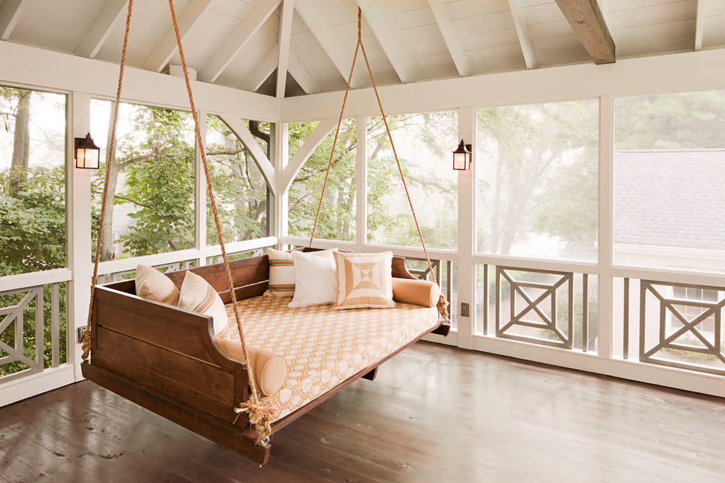 large comfortable porch swing in screened porch