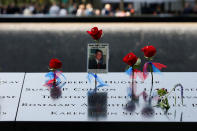 <p>Flowers and mementos are seen left among names at the edge of the south reflecting pool at the National 9/11 Memorial and Museum during ceremonies marking the 16th anniversary of the September 11, 2001 attacks on the World Trade Center in New York, Sept. 11, 2017. (Photo: Brendan McDermid/Reuters) </p>