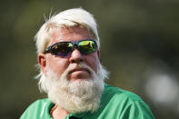 John Daly walks off the fourth tee during the second round of the PNC Championship golf tournament Sunday, Dec. 19, 2021, in Orlando, Fla. (AP Photo/Scott Audette)