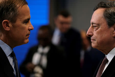 Governor of the Bank of England Mark Carney and European Central Bank President Mario Draghi attend the IMF and World Bank's 2019 Annual Spring Meetings, in Washington, April 13, 2019. REUTERS/James Lawler Duggan