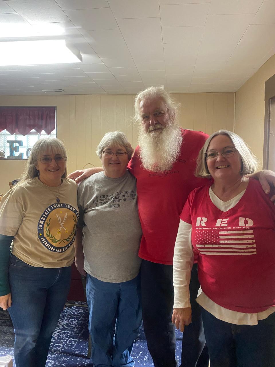 The Santa Claus for the Yellow Ribbon Girls was Dennis Christy of Butler (center). He is flanked left to right by Bonnie Phillippi, Patti Phillippi and Tammi Smith.