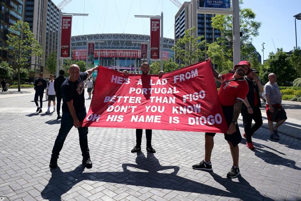 Liverpool fans show off their Diogo Jota banner (PA)