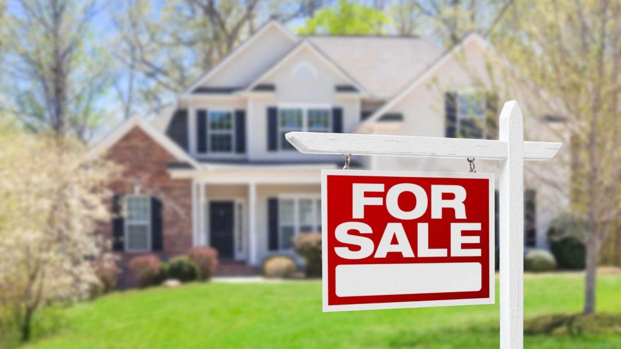 STOCK PHOTO: In this undated stock photo, a 'For Sale' sign stands in front of a house. (STOCK PHOTO/Getty Images)