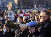 Serbia's Novak Djokovic's father Srdjan speaks during a protest in Belgrade, Serbia, Friday, Jan. 7, 2022. Several hundred people gathered outside Serbian parliament in a show of support for Serbian player Novak Djokovic as he battles the Australian legal system in an attempt to be allowed to stay in the country and compete in the Australian Open later this month. (AP Photo/Darko Vojinovic)