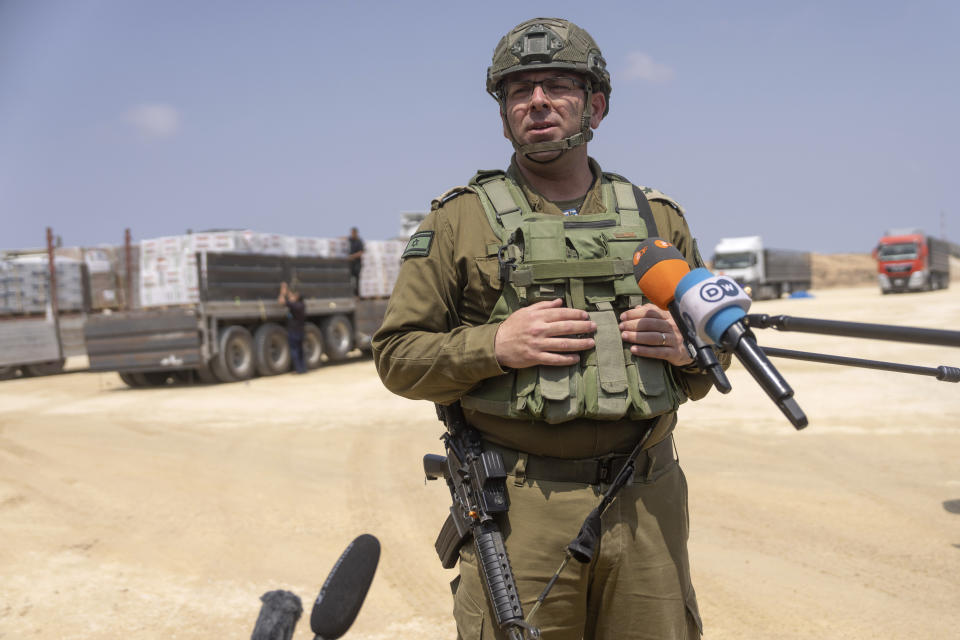 Col. Moshe Tetro, head of COGAT's Coordination and Liaison Administration (CLA) for Gaza, speaks to journalists at an inspection area for trucks carrying humanitarian aid supplies bound for the Gaza Strip, on the Palestinian side of the Erez crossing from southern Israel, Wednesday, May 1, 2024. (AP Photo/Ohad Zwigenberg)