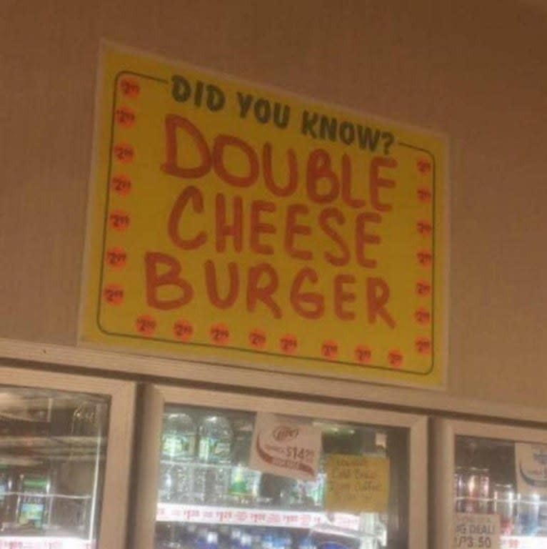 sign reading did you know double cheeseburger