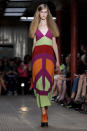 A model wears a design from the Mochino Cheap And Chic Spring/Summer 2013 collection during London Fashion Week, Saturday, Sept. 15, 2012. (AP Photo/Jonathan Short)