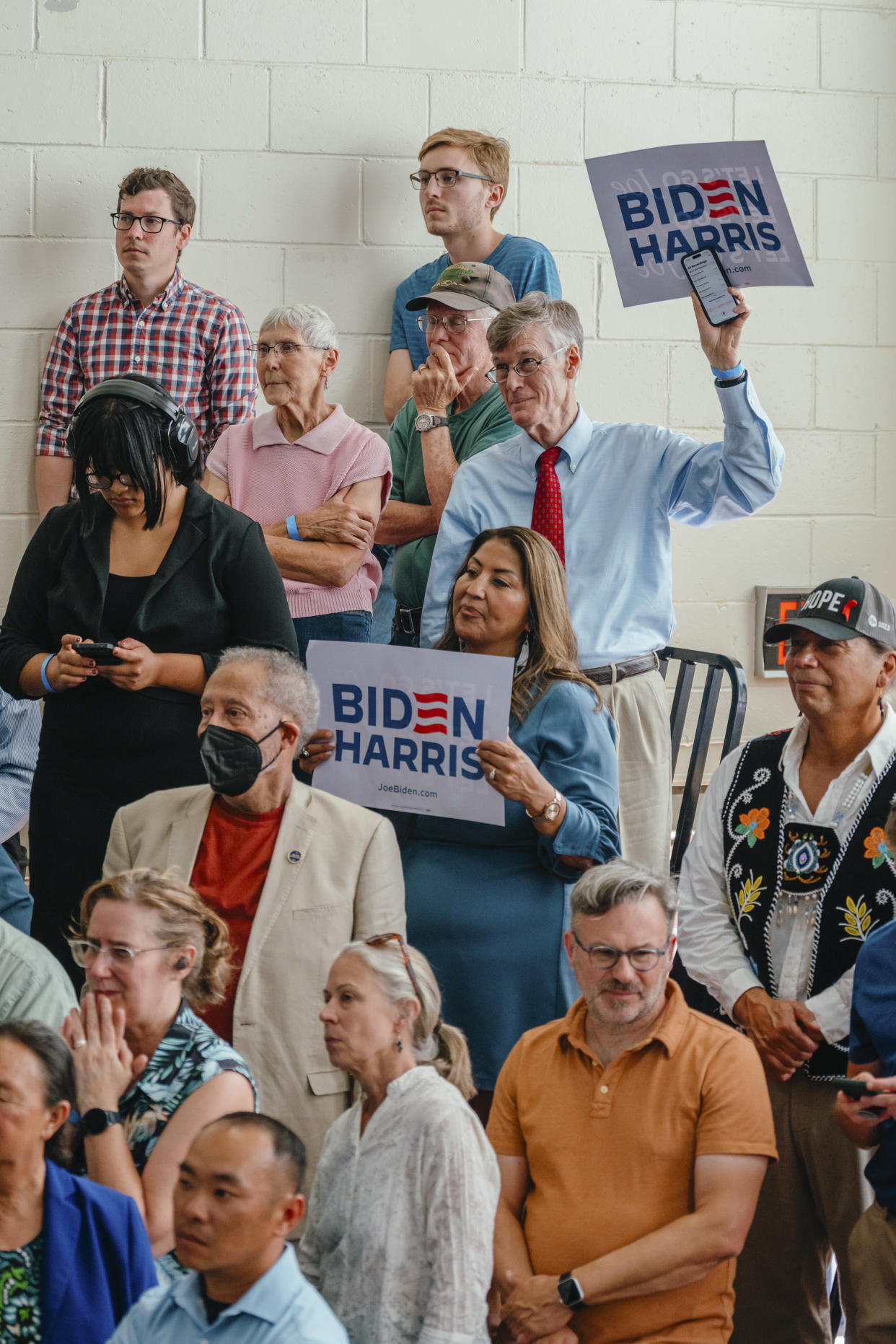 Attendees listen to President Joe Biden speaking at a campaign event in Madison, Wis., on July 5, 2024. (Jamie Kelter Davis/The New York Times)