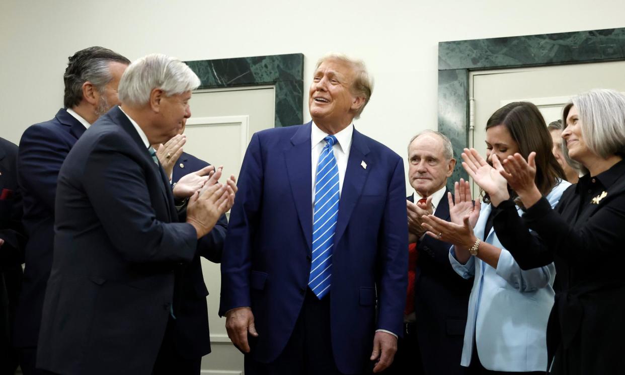 <span>Donald Trump with Senate Republicans on Capitol Hill on Thursday.</span><span>Photograph: Anna Moneymaker/Getty Images</span>