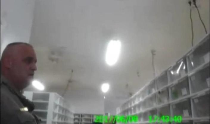 Body cam video shows a Montgomery County sheriff&#39;s deputy taken aback while walking through the snake-filled facility. / Credit: Evidence