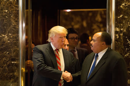 President-elect Donald Trump shakes hands with Martin Luther King III, an American human rights advocate, at Trump Tower in Manhattan, New York City. REUTERS/Alex Wroblewski