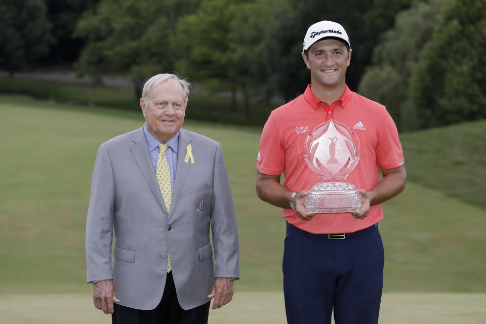 Jon Rahm, of Spain, right, poses with Jack Nicklaus and the trophy after winning the Memorial golf tournament, Sunday, July 19, 2020, in Dublin, Ohio. (AP Photo/Darron Cummings)