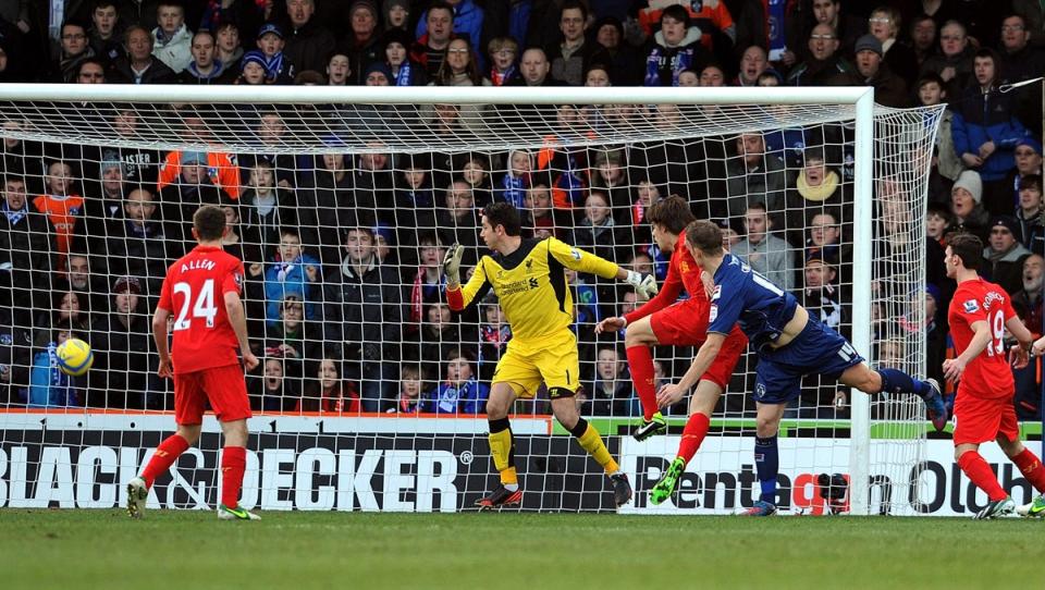 Smith made his name with two goals to help Oldham dump Liverpool out the FA Cup in 2013, having already earned a degree in business management (Liverpool FC via Getty Images)