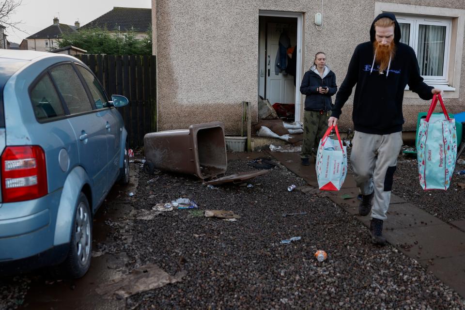 Residents in the Kinloss Park area start to clear up following the affects of Storm Gerrit on December 28 (Getty Images)