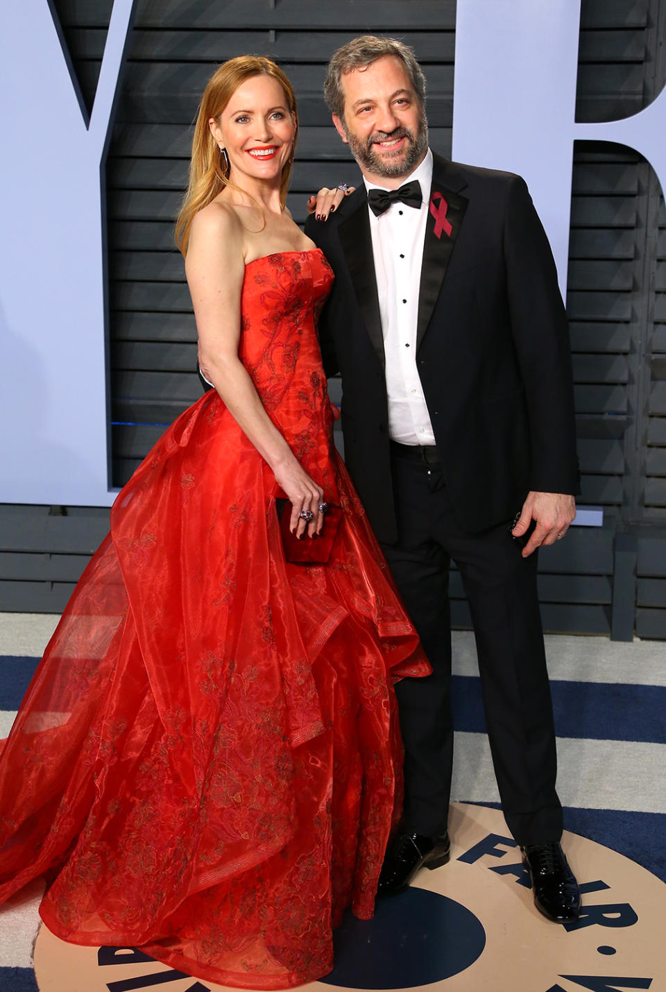 <p>The actress, pictured with her producer husband, was the belle of the ball in her red Zac Posen gown. (Photo: JEAN-BAPTISTE LACROIX/AFP/Getty Images) </p>
