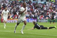 England's Raheem Sterling celebrates after scoring his side's opening goal during the Euro 2020 soccer championship round of 16 match between England and Germany, at Wembley stadium in London, Tuesday, June 29, 2021. (Andy Rain, Pool via AP)