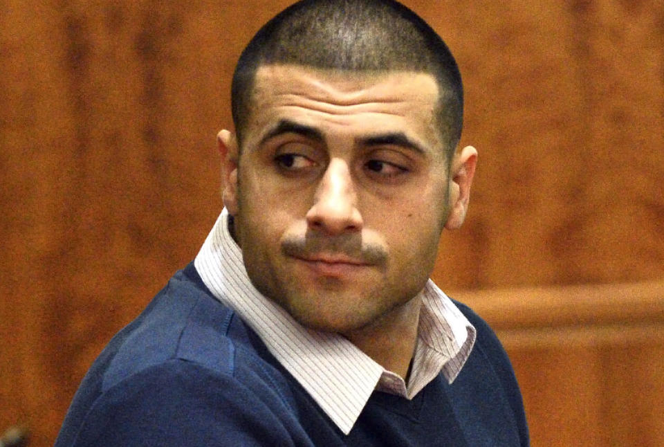 Dennis Hernandez, brother of former New England Patriots football player Aaron Hernandez, has been arrested for alleged threats of gun violence. (AP Photo/The Boston Herald, Ted Fitzgerald, Pool)