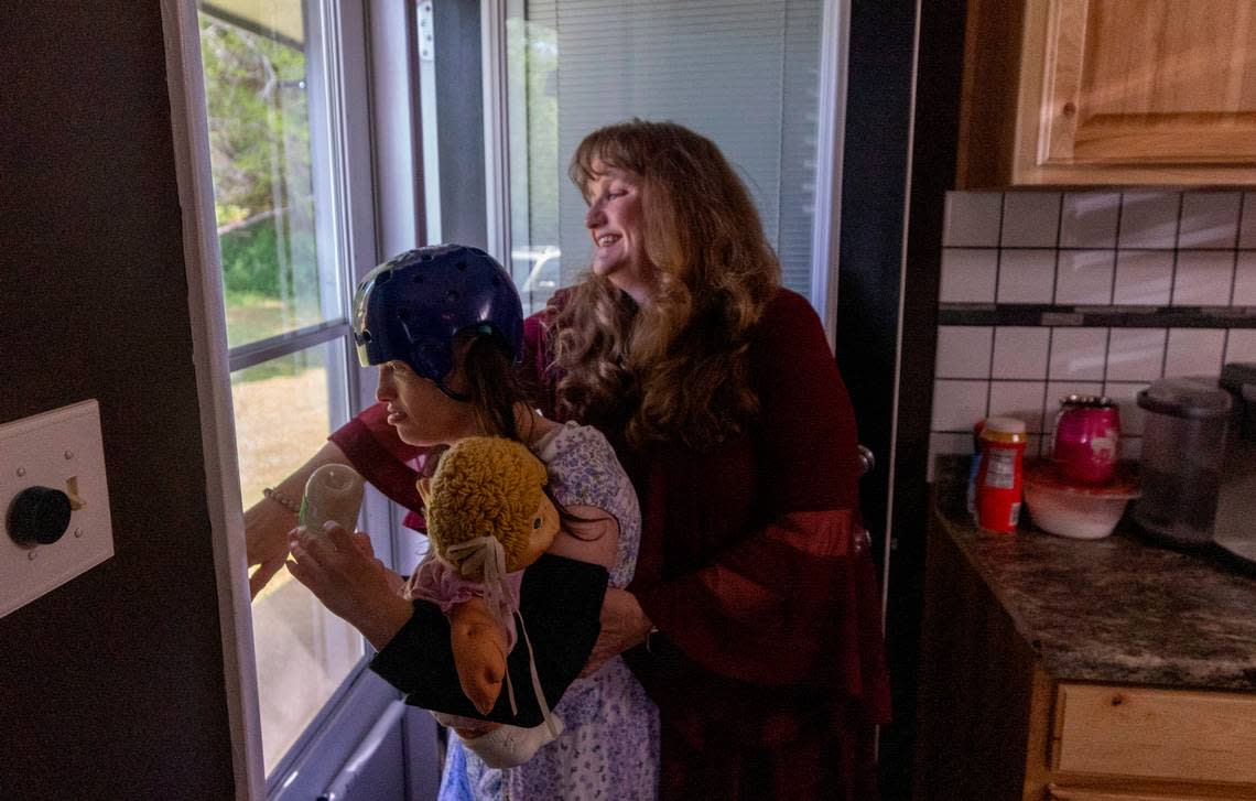 Dana Rhoney spends time with her daughter Samantha, who has a moving disorder and an intellectual disability, at their home near Claremont on Tuesday, April 23, 2024. The Rhoneys filed a lawsuit in 2017 that became known as the Samantha R. case. Disability Rights NC argued that the failure to provide access to community- and home-based behavioral health services violated the rights of people with disabilities. Travis Long/tlong@newsobserver.com