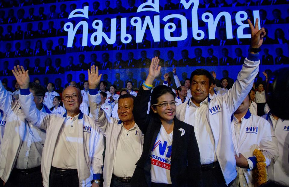 The leader of Pheu Thai Party and candidate for prime minister Sudarat Keyuraphan, second right, and contestants wave during an election rally of general elections in Bangkok, Thailand, Friday, March 22, 2019. The nation's first general election since the military seized power in a 2014 coup is scheduled to be held on March 24. (AP Photo/Gemunu Amarasinghe)