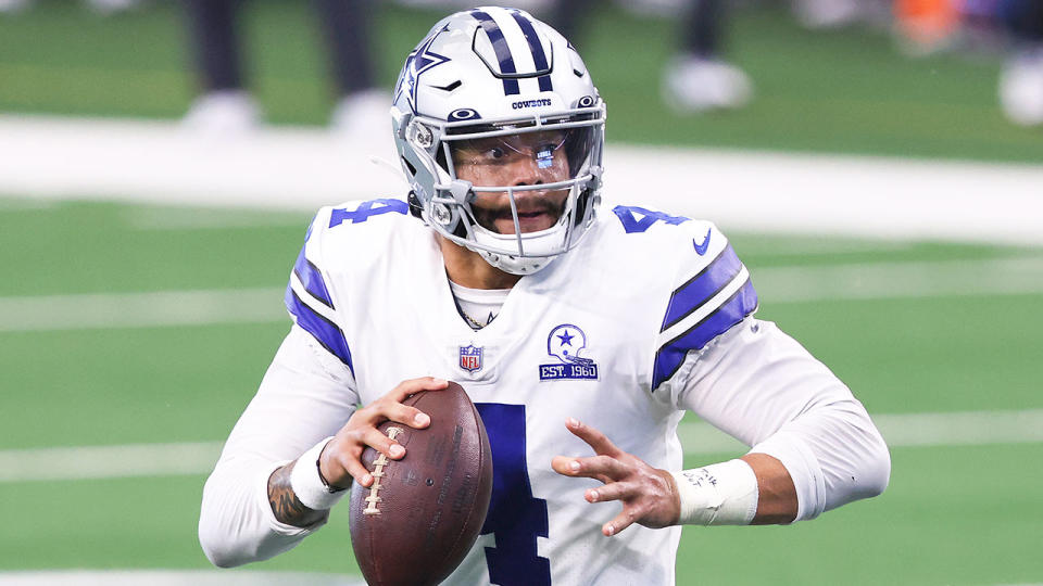 Pictured here, Dallas Cowboys quarterback Dak Prescott gets ready to throw the ball.