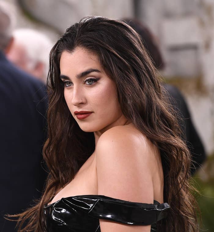 Jauregui looks over her shoulder at an event