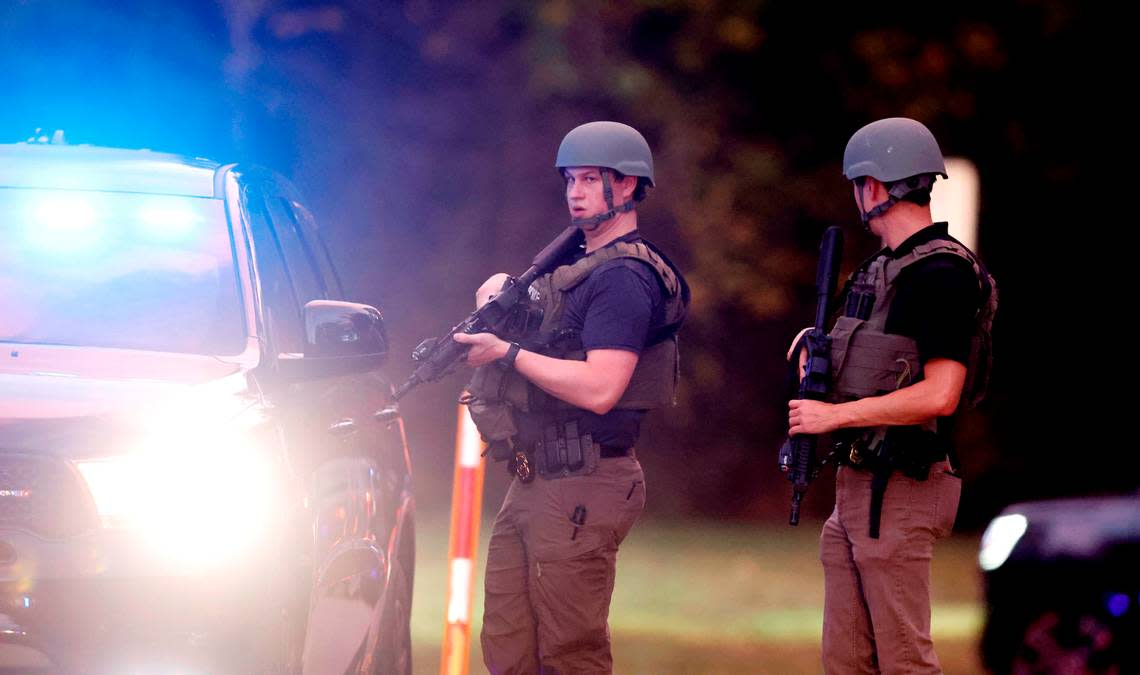 Police stand at the entrance to Neuse River Greenway Trail parking lot at Abington Lane in Raleigh, N.C., Thursday, October 13, 2022. Ethan Hyman/ehyman@newsobserver.com