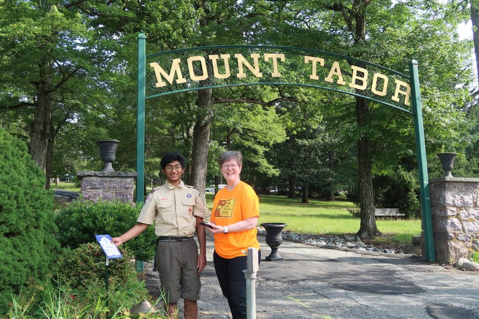 Eagle Scout candidate Eashan Iyer with Mount Tabor Historical Society Present Michelle LaConto Munn outside the gated entrance to the historic Mount Tabor neighborhood in Parsippany.
