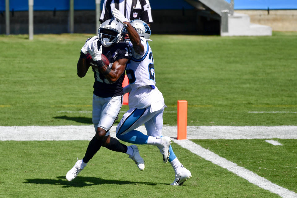 Las Vegas Raiders wide receiver Nelson Agholor, left, catches a touchdown pass in front of Carolina Panthers cornerback Troy Pride Jr. during the first half of an NFL football game Sunday, Sept. 13, 2020, in Charlotte, N.C. (AP Photo/Mike McCarn)