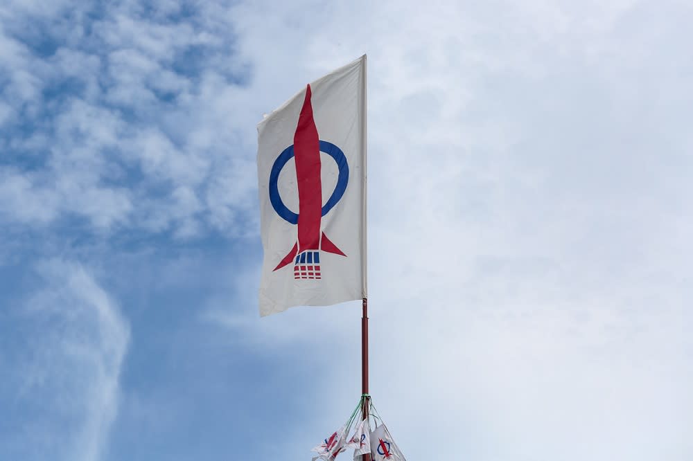 DAP flags are seen along a road in Kuching December 15, 2021. — Picture by Yusof Mat Isa