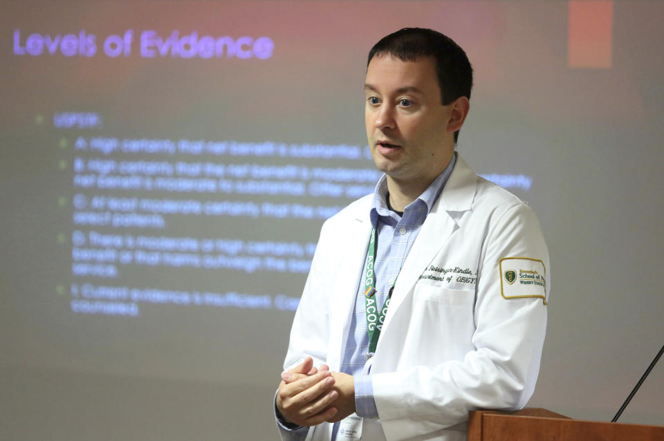 Dr. Keith Reisinger-Kindle, associate director of the OB-GYN residency program at Wright State University's medical school in Dayton, Ohio, leads a lecture of OB-GYN residents in the Wright State program Wednesday, April 13, 2022. (AP Photo/Paul Vernon)