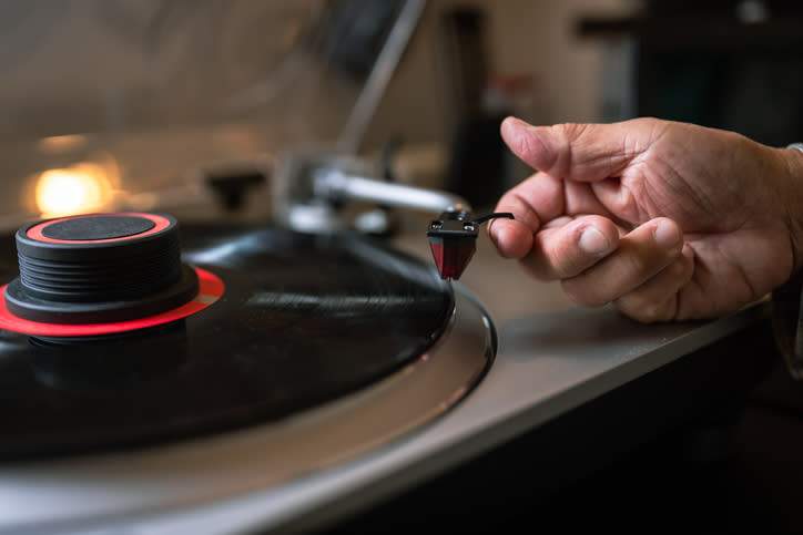 someone playing a vinyl record