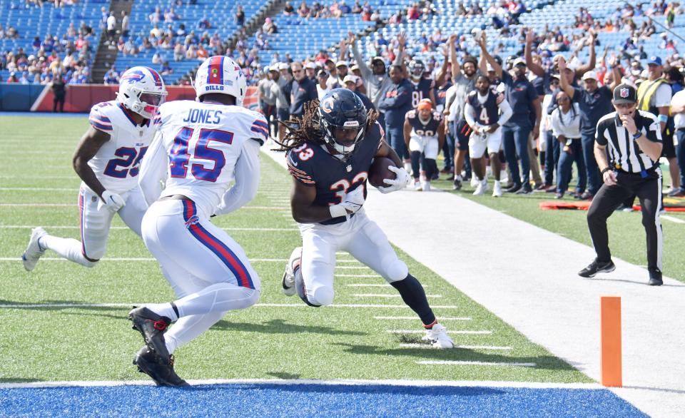 Aug 10, 2024; Orchard Park, New York, USA; Chicago Bears running back Ian Wheeler (33) beats Buffalo Bills linebacker Deion Jones (45) to the endzone to score a touchdown in the fourth quarter of a pre-season game at Highmark Stadium. Mandatory Credit: Mark Konezny-USA TODAY Sports