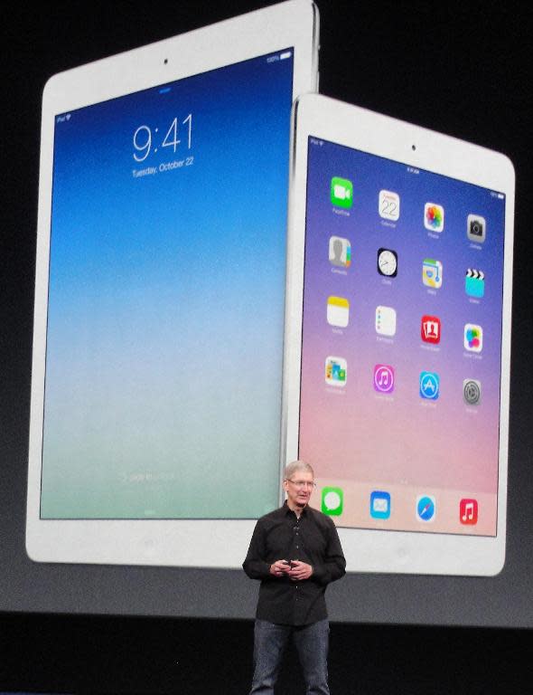 Apple chief executive Tim Cook shows off new iPad Air and iPad mini tablets on October 22, 2013 in San Francisco, California