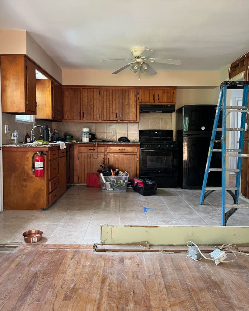 Ceiling fan in kitchen before renovation.