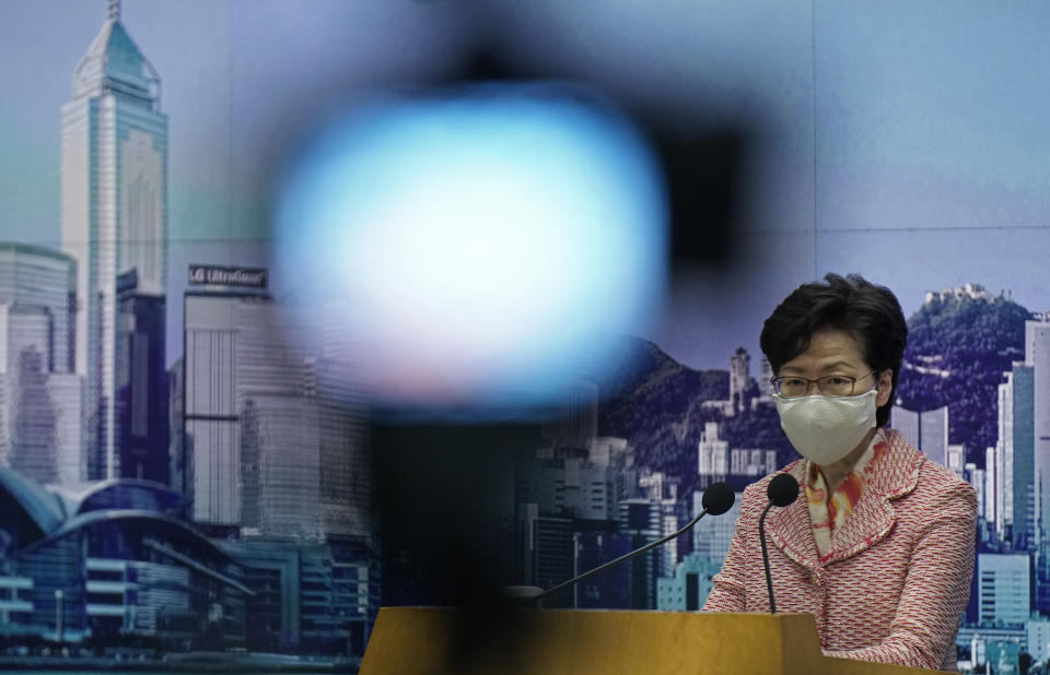 Hong Kong Chief Executive Carrie Lam listens to a reporter's questions during a press conference in Hong Kong, Tuesday, Sept. 22, 2020. Lam said the semi-autonomous Chinese territory has seen its image damaged in the international arena following China’s imposition in June of a sweeping national security law demanding total loyalty to China’s ruling Communist Party. Lam declined to comment directly to reporters on the reasons behind the resignation of an Australian judge on Hong Kong’s top court that has raised the questions about the future of judicial independence in the territory. (AP Photo/Vincent Yu)