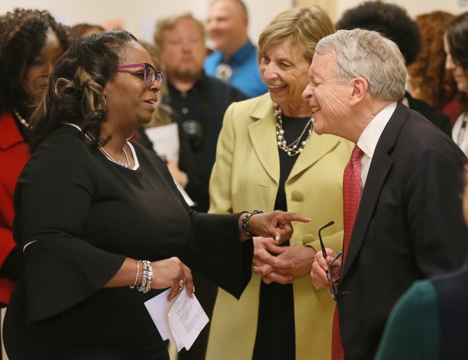 Helen Arnold Community Learning Center Principal LaMonica Davis talks with First Lady Fran DeWine and Gov. Mike DeWine as they tour the school Tuesday in Akron.