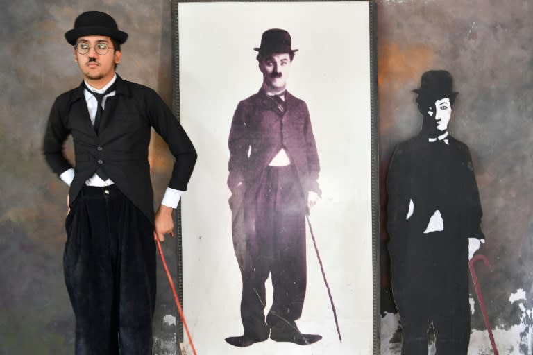 Local villager Talin Mavani checked out his outfit against an image of Chaplin