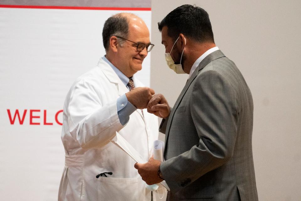 Aug 3, 2022; Columbus, OH, USA;  Coach Ryan Day fist bumps, Dr. Andrew Thomas, during a press conference where coach Ryan Day and his wife, Nina, announce a $1 million donation to fund research and services that promote mental health at The Ohio State University Wexner Medical Center and College of Medicine. The Nina and Ryan Day Resilience Fund will be housed in the Department of Psychiatry and Behavioral Health.