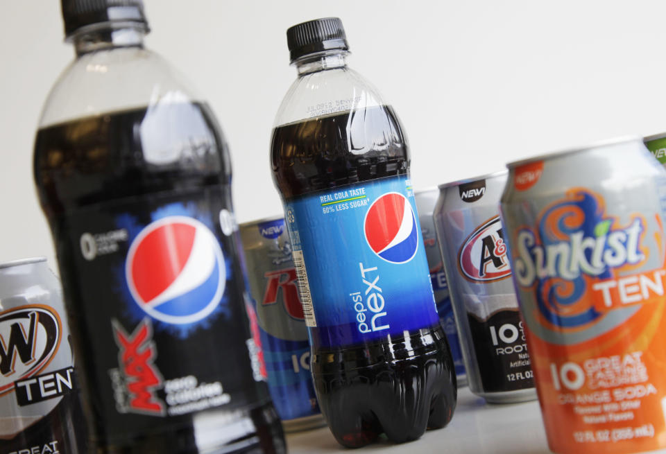 A Monday, June 11, 2012, photo shows bottles of Pepsi Next and Pepsi Max displayed amongst cans of ten-calorie sodas from PepsiCo. in New York. Coke and Pepsi are chasing after the sweet spot: a soda with no calories, no artificial sweeteners and no funny aftertaste. The world's top soft drink companies hope that's the elusive trifecta that will silence health concerns about soda and reverse the decline in consumption of carbonated drinks. But coming up with such a formula could still be years away. (AP Photo/Mark Lennihan)