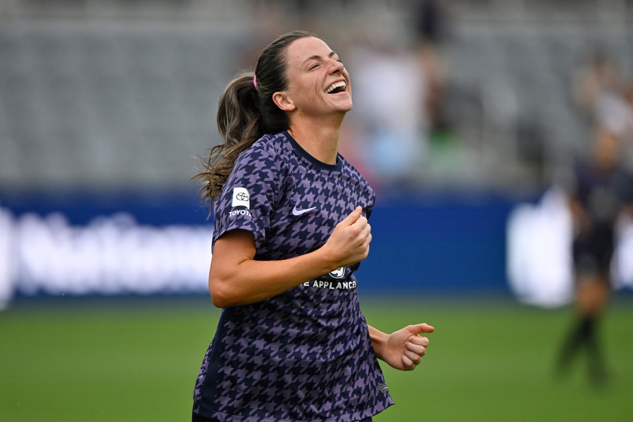 Jul 21, 2023; Louisville, KY, USA; Racing Louisville FC defender Paige Monaghan (5) celebrates a goal in the first half against the Chicago Red Stars at Lynn Family Stadium. Mandatory Credit: Jamie Rhodes-USA TODAY Sports