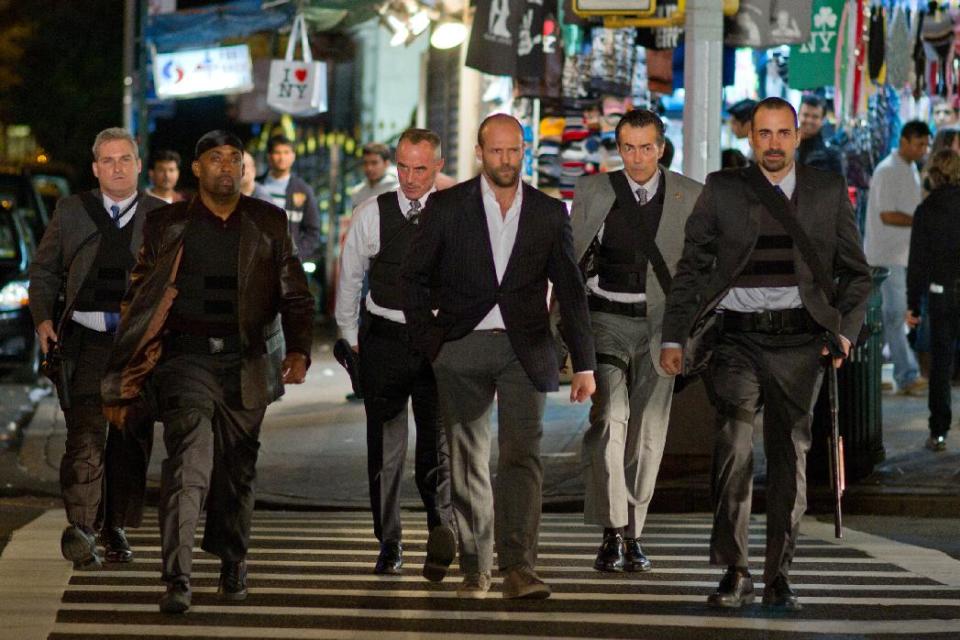 In this film image released by Lionsgate, from left, James Colby, portraying Detective Mears, Barry Bradford, portraying Detective Benoit, Robert John Burke, portraying Captain Wolf, Jason Statham, portraying Luke Wright, Matt O'Toole, portraying Detective Lasky and Jay Giannone, portraying Detective Kolfax, are shown in a scene from "Safe." (AP Photo/Lionsgate, John Baer)