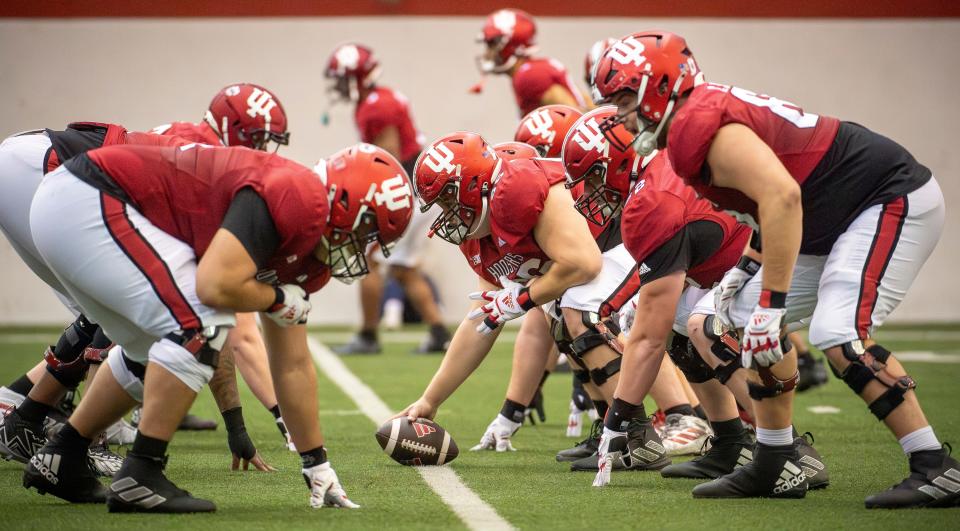 Indiana's Mike Katic (56) prepares to snap the ball during a spring practice at the Mellencamp Pavilion on Thursday, April 11, 2024.