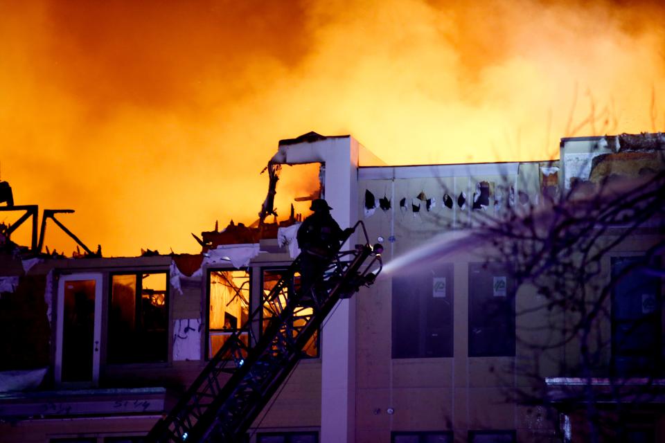 Fire crews battle a massive blaze Feb. 8, 2022, at the Canton Apartments at Classen Curve in Oklahoma City.